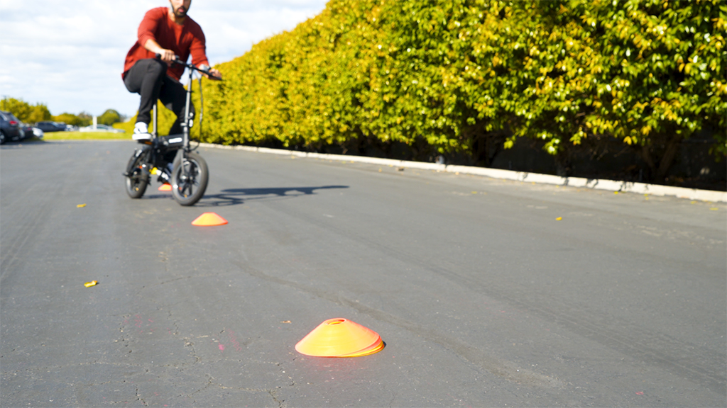 Man wearing a helmet riding on even pavement on his EB5 Pro