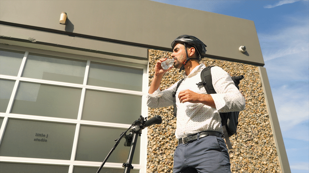 Animated gif of guy drinking water and splashing some on his EB5 Pro