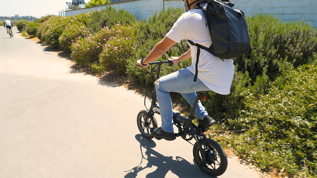 Guy wearing a helmet riding on his EB5 Pro