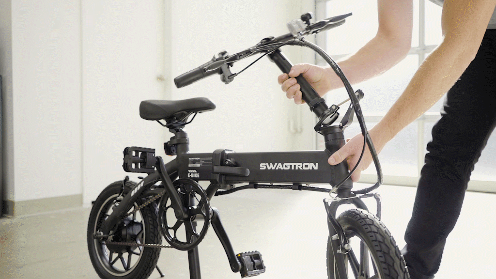 Close-up of guy unfolding the EB5 Pro eBike handle stem