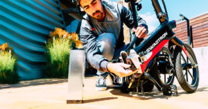Close-up of man swapping the battery on his EB7 Elite eBike
