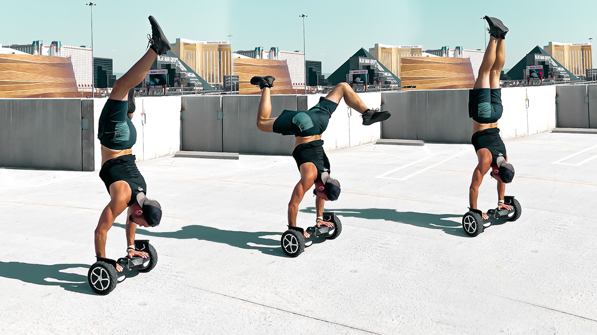 Travis Brewer doing handstands on his T6 hoverboard.