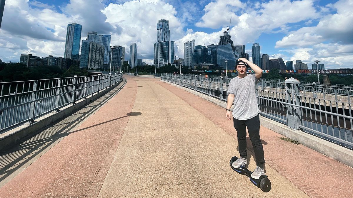 DJ Liquid Candi on his T580 Warrior hoverboard outside